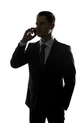 Aufkleber - Silhouette of a businessman on a phone call against a white background