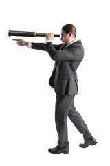 Poster - Businessman using a spyglass to symbolize vision and direction in business on white background