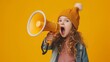 Child screams into megaphone, vibrant energy