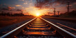 Railway transport rushing along rails forward against background of setting sun,