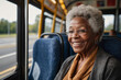 Portrait of a happy senior African American woman traveling by bus