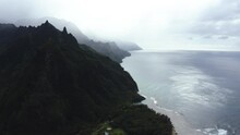 Drone Shot In Front Of The Mountainous Coastline Of Hawaii, Misty Day In USA