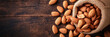 almonds in a sack on wooden background