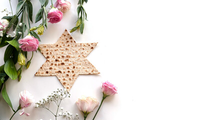 Wall Mural - Passover. banner of Traditional Matzo shape of star Magen David  decorate by pink flowers on white background. top view. Holiday of Jewish people, Spring Holiday. Fasting time