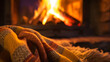 A couple cuddles by a roaring fire, cocooned in a soft blanket, their hearts melting as the flames dance.