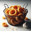 onion rings on a basket on white