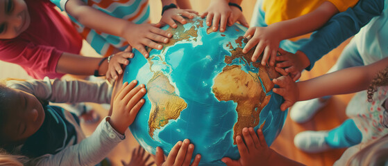 group children holding planet earth and forming a circle around a globe over nature background. worl