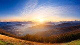 Fototapeta Na ścianę - panoramic view of the sunrise in the mountains valley