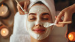 Cosmetologist applies a luxurious moisturizing mask, creating a serene blend of beauty and relaxation in an elegant clinic. Pamper yourself in style.