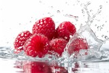Fototapeta Kuchnia - Raspberry fruit and water splash on white background. Wallpaper. Banner. Backdrop