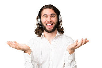 Wall Mural - Telemarketer man working with a headset over isolated chroma key background with shocked facial expression