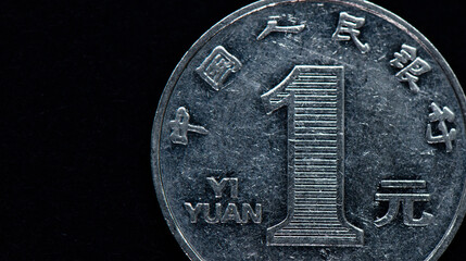 Wall Mural - Money.  Chinese coin One Yuan, close up, black background, copy space, tone correction