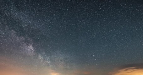 Wall Mural - background of milky way galaxy stars space in starry night sky astronomy time lapse