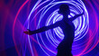 canvas print picture - Silhouette of a woman dancer against a background of neon light