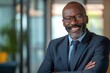 © CStock - Confident portrait middle aged african businessman smilling