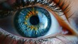 The intricate details of a deep blue iris reveal the inner workings of a delicate organ, framed by fluttering eyelashes and crisscrossing blood vessels, while the dilated pupil reflects a sense of wo