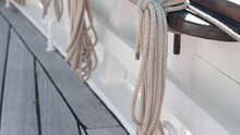 Coils Of Ropes On Board A Sailing Yacht. View From The Deck Of The Boat.