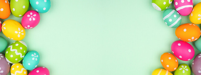 Poster - Colorful Easter Egg double border over a soft green paper banner background. Copy space.