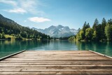 Fototapeta Perspektywa 3d - Wooden jetty over the clean blue lake in mountain forest on sunny summer day