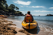 A Lifeguard In An Orange Vest Sits In A Yellow Lifeboat On The Beach.