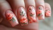 Close-up of hands with detailed floral nail art design.