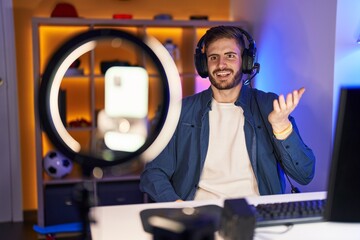 Poster - Hispanic man with beard recording vlog tutorial with smartphone at home celebrating achievement with happy smile and winner expression with raised hand