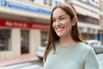 Sticker - Young beautiful woman smiling confident looking to the side at street