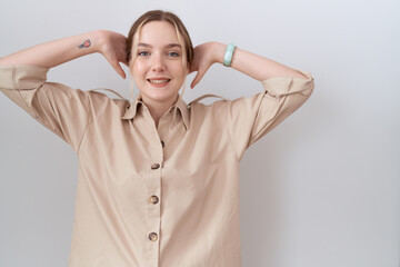 Canvas Print - Young caucasian woman wearing casual shirt relaxing and stretching, arms and hands behind head and neck smiling happy