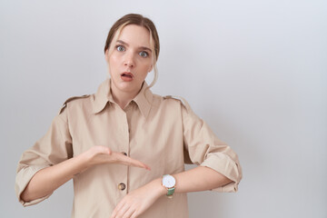 Sticker - Young caucasian woman wearing casual shirt in hurry pointing to watch time, impatience, upset and angry for deadline delay