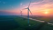Wind turbines generating green energy during sunset as seen from above 