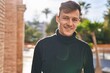 © Krakenimages.com - Young man smiling confident standing at street