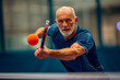 © JLabrador - Senior Man Concentrating on Pickleball Game with Intensity
