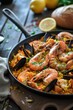 Tradicional Spanish paella with seafood. A dish of rice, shrimp, mussels and other sea creatures. Beautiful still life for restaurant poster