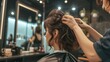 © HY - Hairdresser meticulously cuts a young woman's hair, with the salon's interior and the focused expressions of both captured in sharp detail