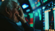 Stressed senior investor pensioner in panic at digital stock market financial crisis. Bear Market Panicking retired man watching crashing stocks plunging slumping bearish recession 