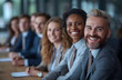 © Lin_Studio - a group of business men and women at work smiling, in the meeting room