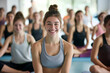 © MagnusCort - A group of women are doing yoga together and one of them is smiling