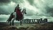 A medieval knight on horseback at famous Stonehenge ancient mystery site in England UK.