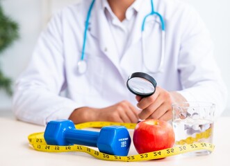 Young male doctor in sport and dieting concept