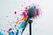 Microphone splattered with colors on solid white background