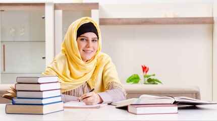 Wall Mural - Female student in hijab preparing for exams