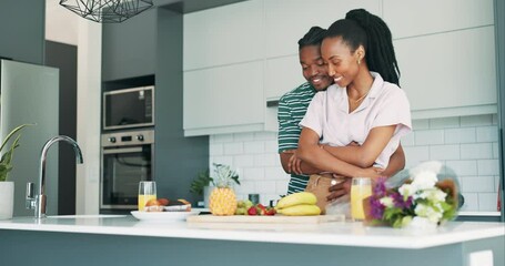 Canvas Print - Couple, cooking and embracing for love in relationship, bonding and conversation by healthy meal in kitchen. Black people, hugging and romance or security in home, breakfast and fruit for nutrition