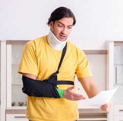 Wall Mural - Young man after car accident suffering at home