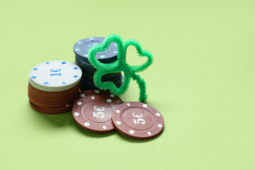 Poker chips with clover on green background. St. Patrick's Day celebration