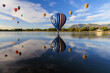 Balloons reflecting on water