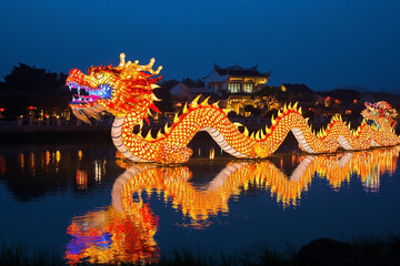 Wall Mural - Dragon is lit up at night during chinese new year. Dragons are the most favourite symbols of Chinese