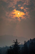 The sun piercing through the smoke from forest fires in British Columbia, Canada