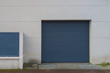 Wall Mural - grey garage door modern automatic up and over on home facade