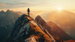 © boxstock production - A male cyclist on a high mountain peak with a stunning view of the sunrise over a rugged landscape