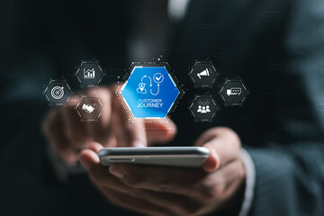 Customer journey concept. Businessman use smartphone with virtual customer journey icon, journey evaluation, Boost satisfaction, encourage repeat business and drive revenue growth.